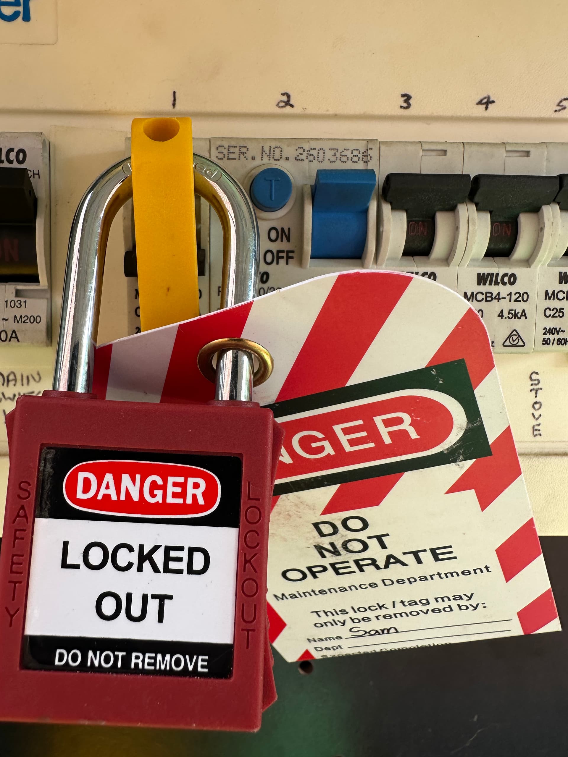 Electrician performing test and tag on portable appliances at a Sydney workplace